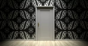 Closed door with tapestry
