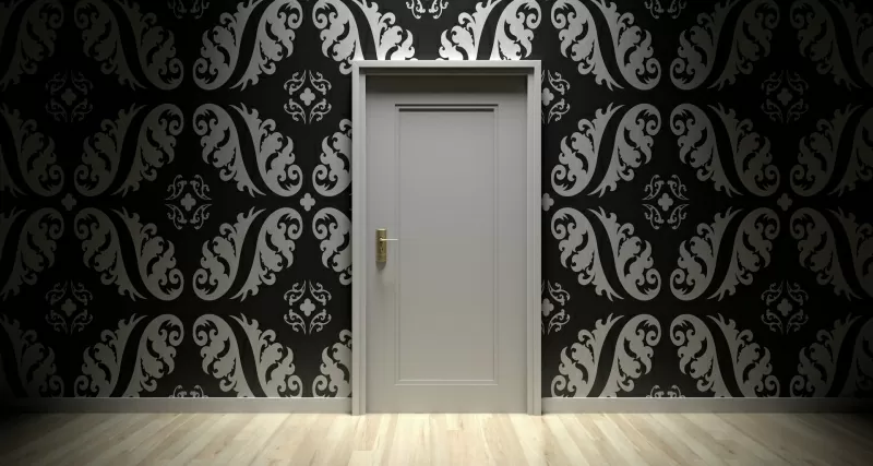 Closed door with tapestry